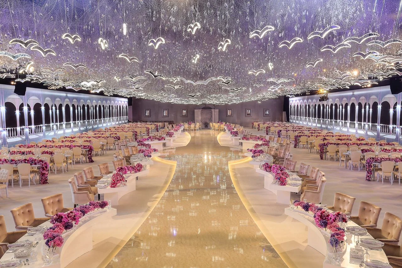 Wedding reception under a canopy of pink flowers and lights